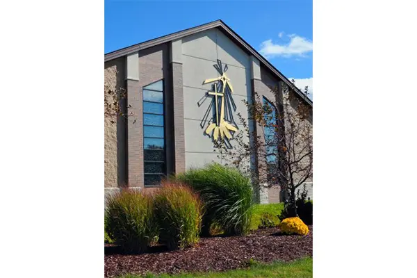 A building with a large mural on the side of it.
